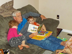 Gramps reading to Eliana and Zach.